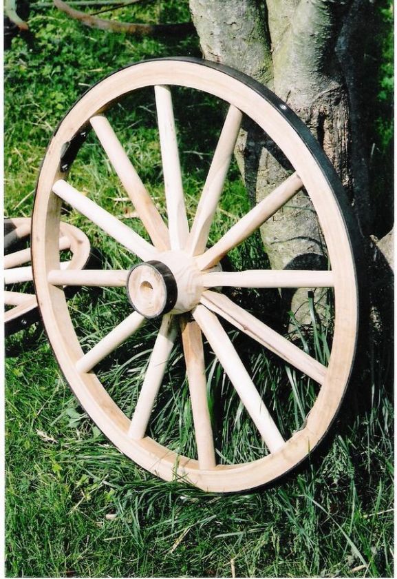FOUR WESTERN WAGON WHEELS FOR CARTS DECOR PRODUCTIONS.  